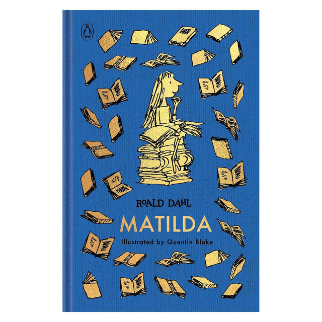 Blue clothbound book cover featuring gold illustrations of books and a girl sitting on a tall stack of books.
