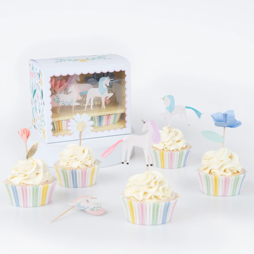 A set of cupcake decorations featuring whimsical unicorn toppers and colorful wrappers with floral designs, perfect for magical-themed parties.