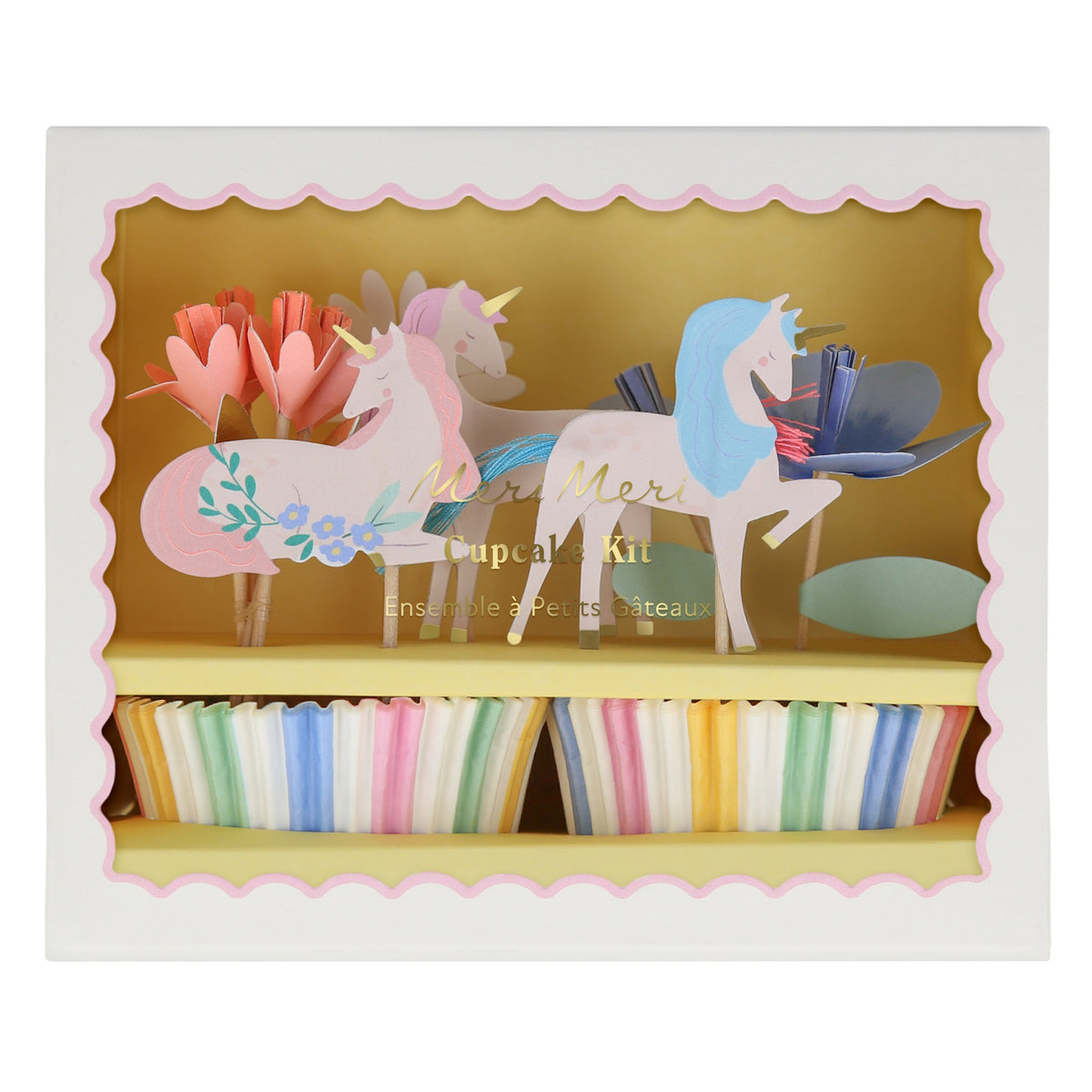 Meri Meri unicorn cupcake kit box with decorative unicorn and flower toppers and colorful striped baking cups.