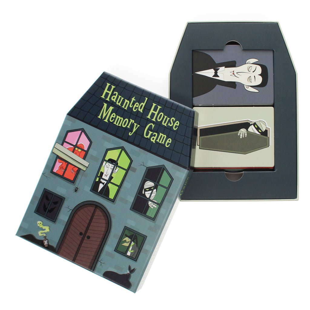 Box and cards of a "Haunted House Memory Game." The box resembles a haunted house with spooky characters in windows. Cards feature vampire and mummy. Eerie and playful vibe.