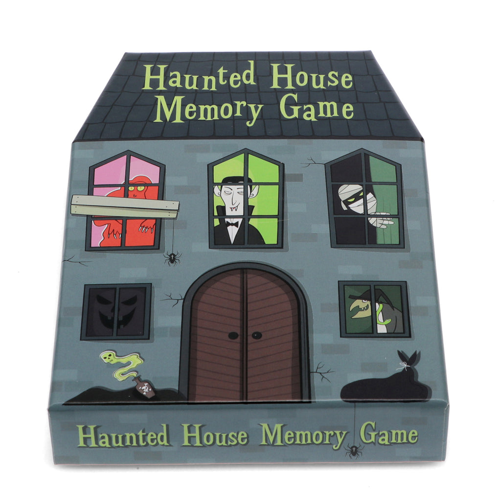 Illustrated box cover for a "Haunted House Memory Game" featuring cartoon monsters in windows of a spooky house, conveying a playful and eerie mood.