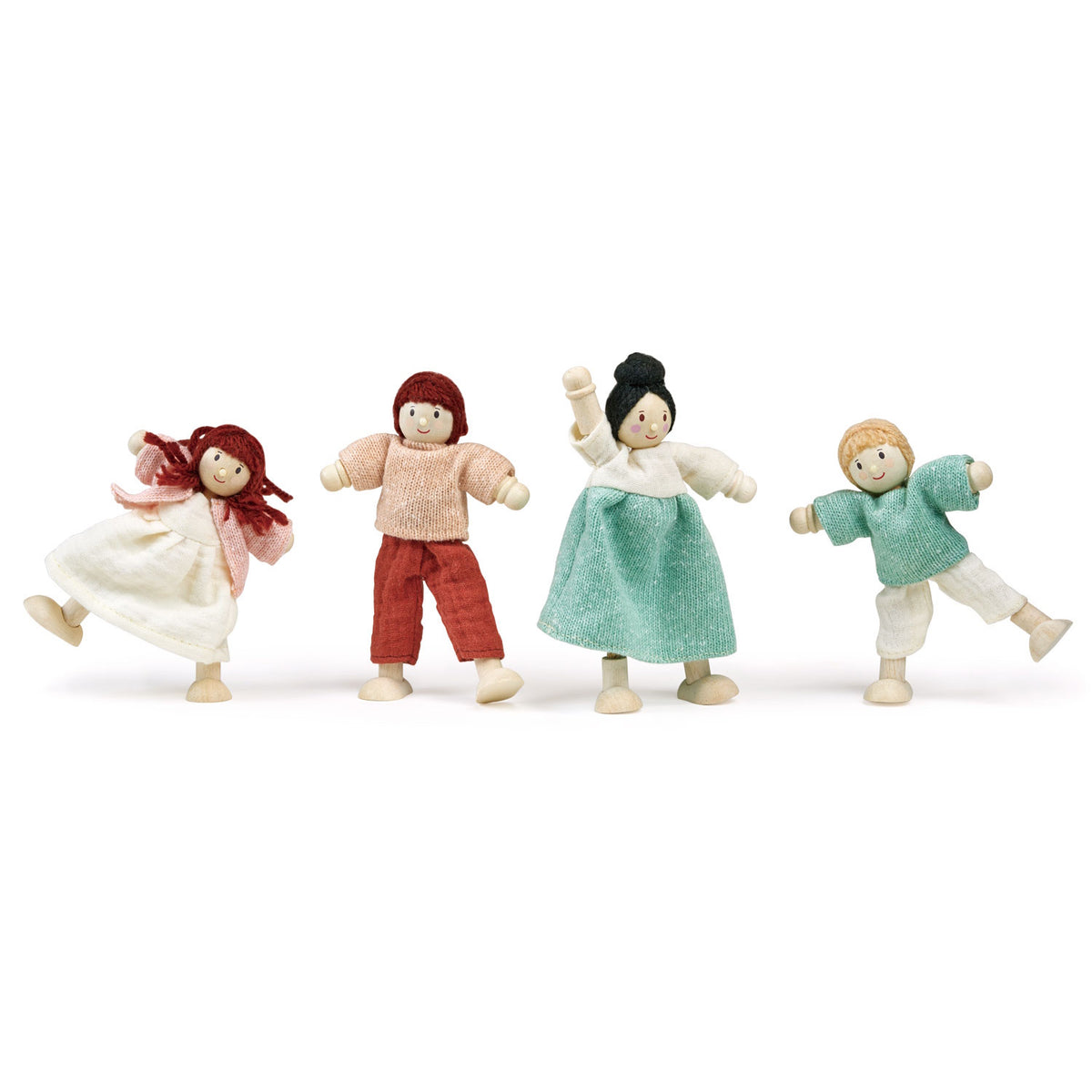 Four bendable wooden dolls standing and posing in a row.