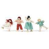 Four bendable wooden dolls standing and posing in a row.