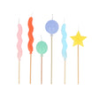 Meri Meri colorful balloon, star, and wavy birthday candles on wooden sticks for cake decoration and party supplies.