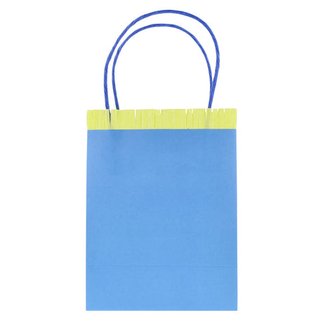 Blue party gift bag with yellow fringe trim and blue twine handles on a white background.