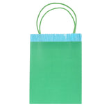 Green Meri Meri party bag with blue fringe trim and green handles for celebrations and birthdays.