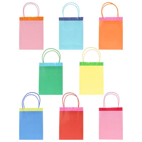 Set of 8 colorful Meri Meri party bags with fringe trim and matching twine handles in various bright shades.