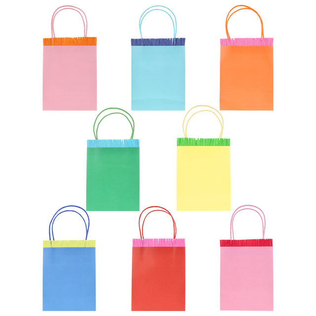 Set of 8 colorful Meri Meri party bags with fringe trim and matching twine handles in various bright shades.