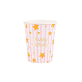 Meri Meri pink striped Happy Birthday paper cup with gold foil stars and script on a white background.
