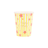Meri Meri Bright Star Happy Birthday party cup with yellow stripes, pink stars, and gold foil text on a white background.