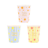 Meri Meri Bright Star Happy Birthday party cups in pink, blue, and yellow with gold foil stripes and stars.
