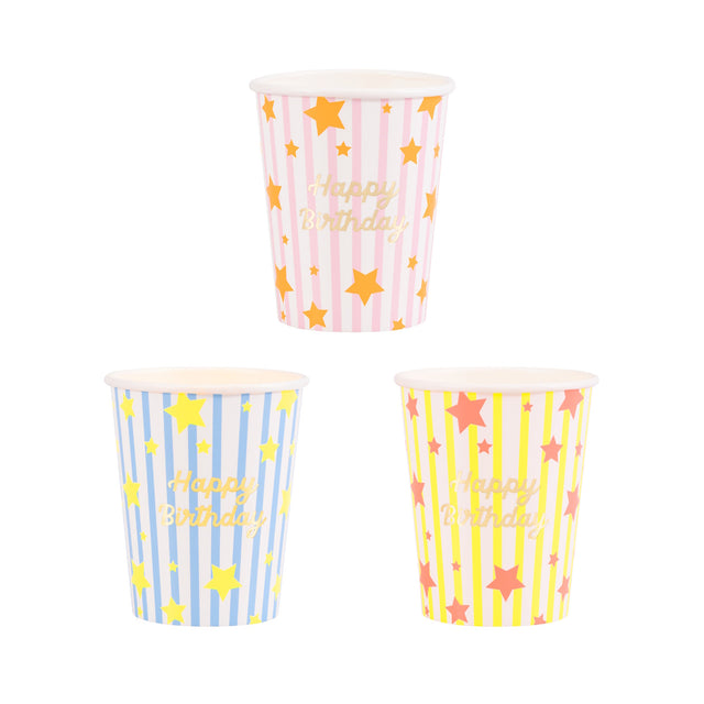 Meri Meri Bright Star Happy Birthday party cups in pink, blue, and yellow with gold foil stripes and stars.