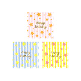 Meri Meri Bright Star Happy Birthday napkins in pink, blue, and yellow with gold foil stars and scalloped edges.