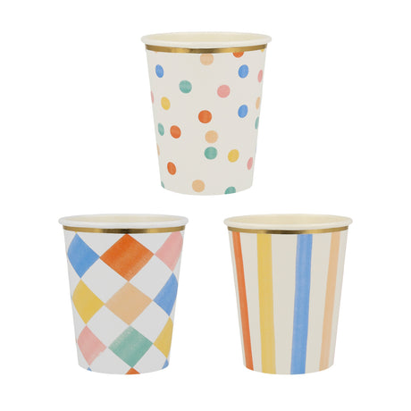Meri Meri colorful pattern paper cups with gold foil rims featuring polka dots, diamonds, and stripes for parties.