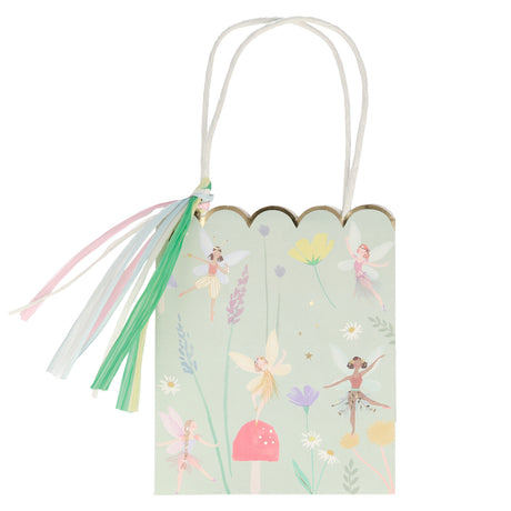 Meri Meri fairy party bag with floral illustrations, fairies, and a colorful tassel. Perfect for a fairy garden birthday.