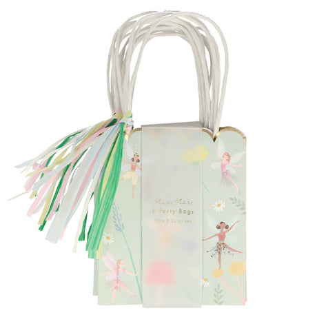 Meri Meri fairy party bags with colorful tassels, floral illustrations, and white paper handles for children's birthdays.