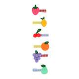 Set of 6 Meri Meri fruit hair clips featuring strawberry, lemon, cherry, orange, grape, and pear felt designs on gingham clips.