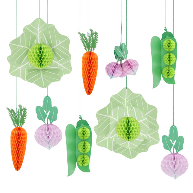 Hanging paper honeycomb vegetable decorations featuring carrots, radishes, peas, and cabbages for garden party decor.