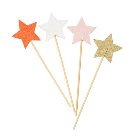 Set of four Meri Meri glitter star wands in orange, white, pink, and gold on wooden sticks for parties and dress-up.