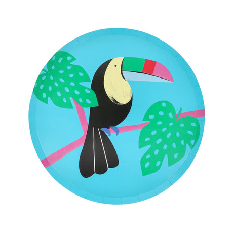 Toucan paper side plate with colorful beak and green tropical leaves on a bright blue background.