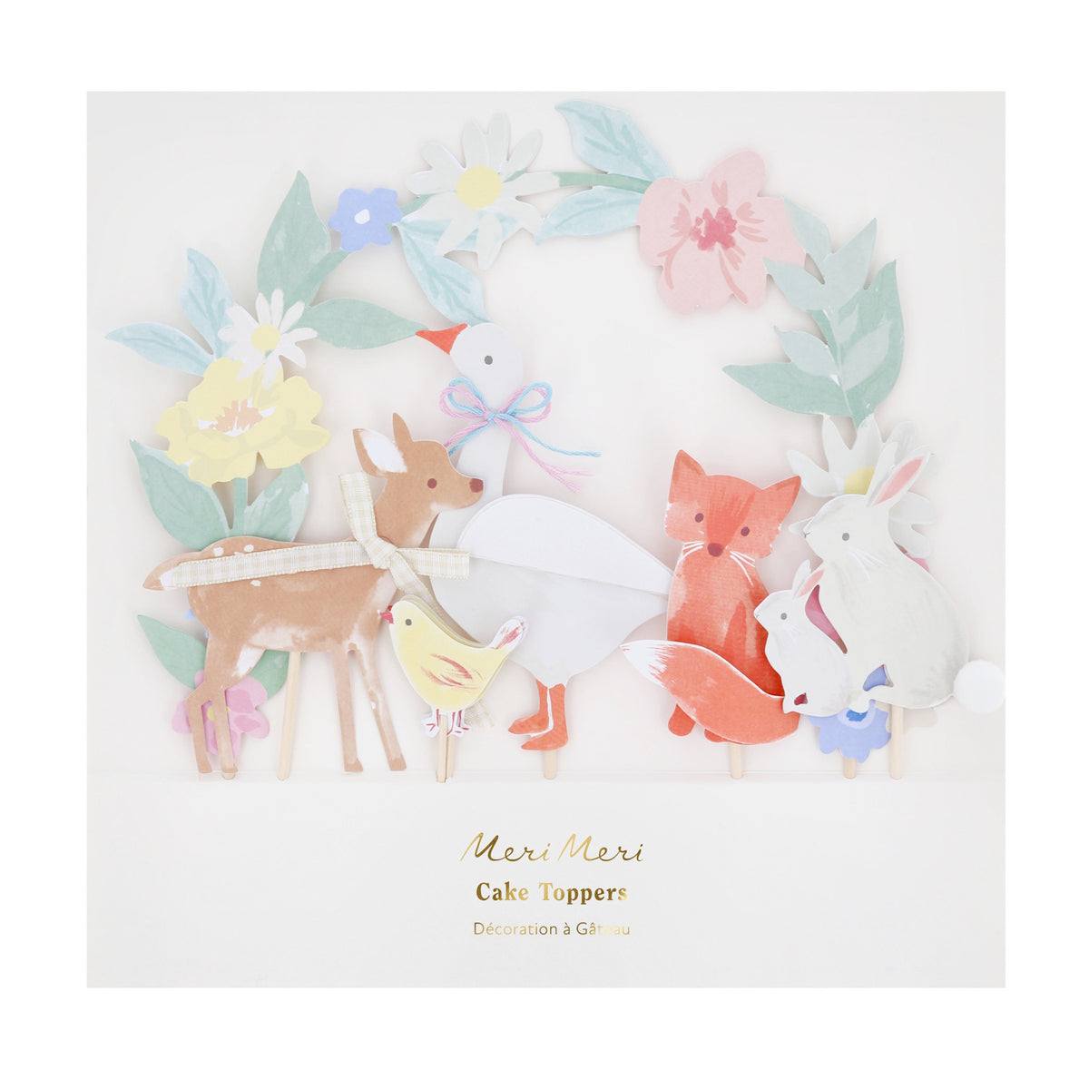 Meri Meri woodland animal cake toppers featuring a paper deer, fox, swan, and bunnies with floral accents for party decor.