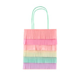 Rainbow fringed paper party bag with pastel tissue paper layers and mint green handles.