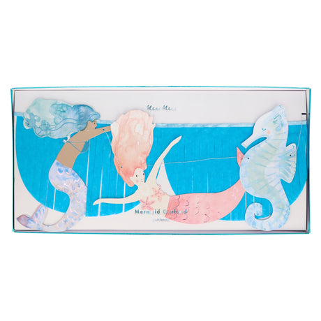 Meri Meri Mermaid Fringe Garland featuring two mermaids and a seahorse with blue tissue paper fringe for party decor.