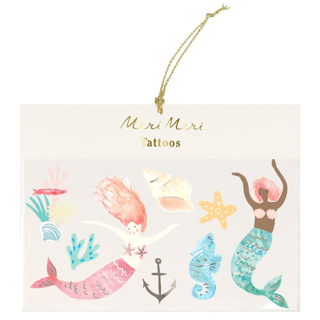 Meri Meri mermaid temporary tattoos featuring colorful mermaids, seahorses, and shells for kids' party favors.