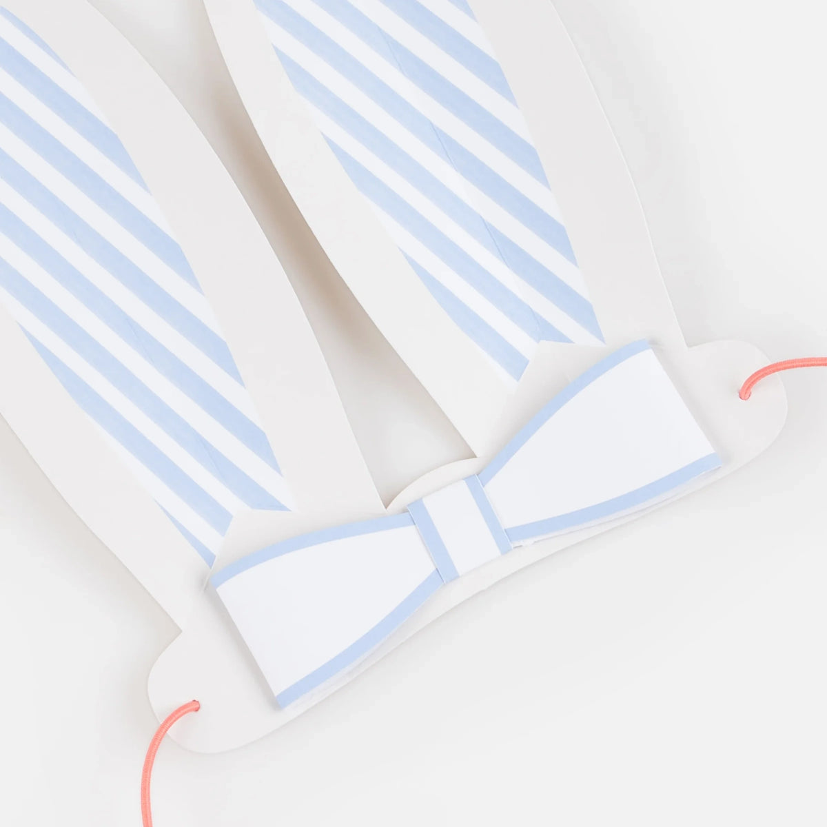 White and blue striped paper bunny ears with a matching bow tie and pink elastic string for Easter party costumes.