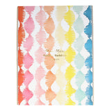 Meri Meri Rainbow Backdrop featuring colorful twisty fringe streamers in a repeating pattern for party decorations.