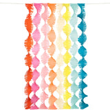 Meri Meri rainbow twisty fringe backdrop with colorful crepe paper streamers for party decorations on a white background.