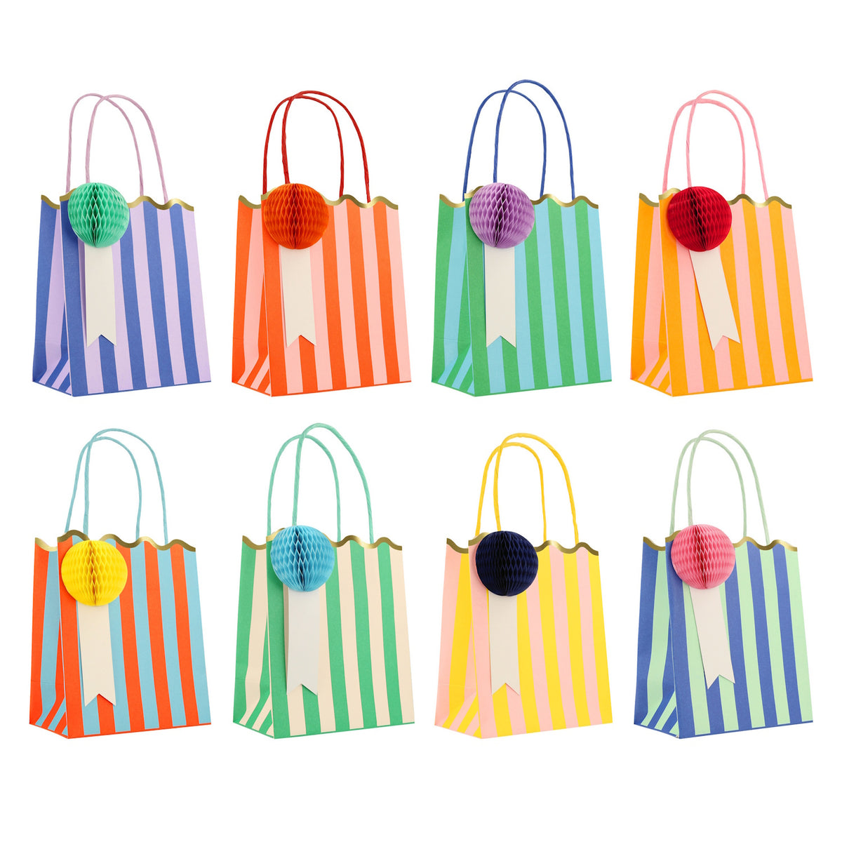 Colorful striped party bags with honeycomb pom-pom charms and scalloped gold foil edges by Meri Meri.