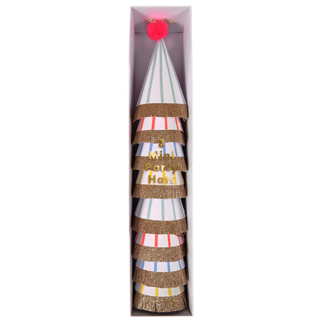 Set of 8 Meri Meri mini striped party hats with gold glitter fringe and a pink pom-pom in a slim white box.