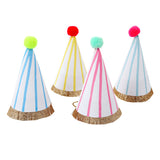 Four mini striped party hats with colorful pom-poms and gold glitter fringe for birthday celebrations and events.