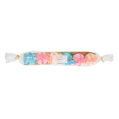Meri Meri velvet bow surprise balls in pastel colors, a set of colorful party favors wrapped in clear gift packaging.