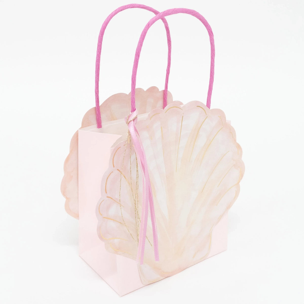 Pink seashell-shaped gift bag with bright pink handles and a small ribbon tassel against a white background.