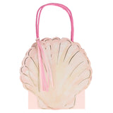 Pink seashell-shaped gift bag with matching handles and tassel.