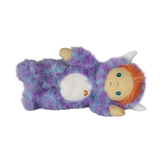 Plush doll lying on its side wearing a fuzzy purple monster suit with white horns and orange hair.