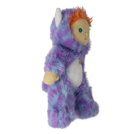 Profile view of plush doll in a fuzzy purple monster suit facing right with white horns and orange hair.