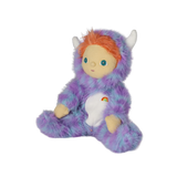 Seated plush doll in a fuzzy purple monster suit with white horns, orange hair, and blue eyes.