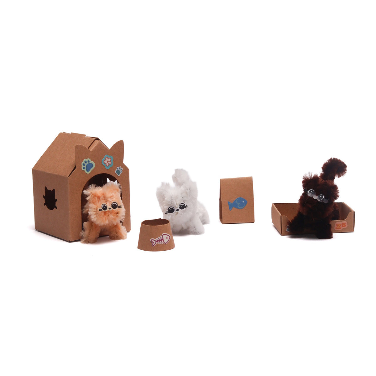 Three small fluffy craft kittens with cardboard accessories, including a playhouse, bowl, and bed.