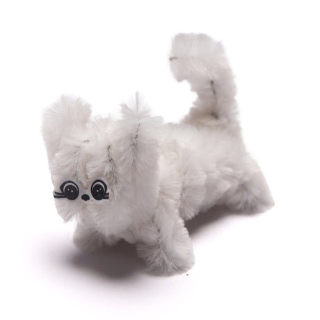 Small white cat crafted from fuzzy pipe cleaners on a plain white background.