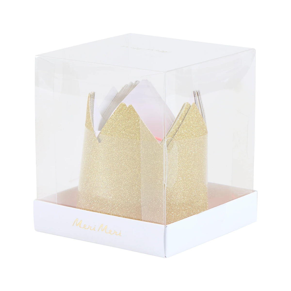 Clear plastic cube box displaying mini gold glitter party crowns inside.