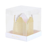 Clear plastic cube box displaying mini gold glitter party crowns inside.