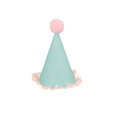 Mini mint green party hat with a pink pom-pom and fringed trim on a white background.