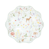 A wavy-edged pastel green paper plate featuring a delicate woodland animal and wildflower pattern.