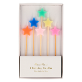Boxed set of six Meri Meri star-shaped birthday candles on long wooden sticks in colorful pastel shades.