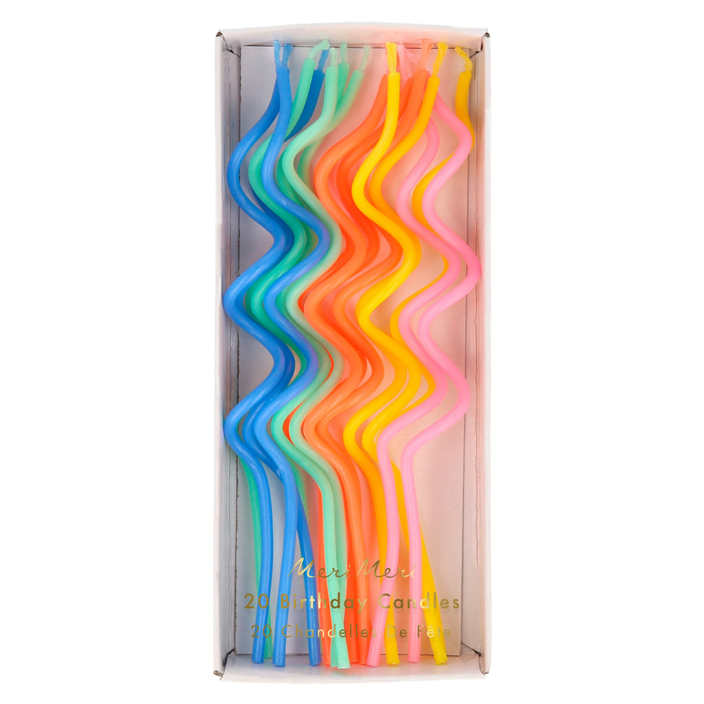 A set of elegant swirl-shaped candles in assorted colors, ideal for adding a stylish touch to cakes and parties.