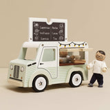 Wooden toy café van with menu board top, opening window, and toy wooden figure standing beside it.