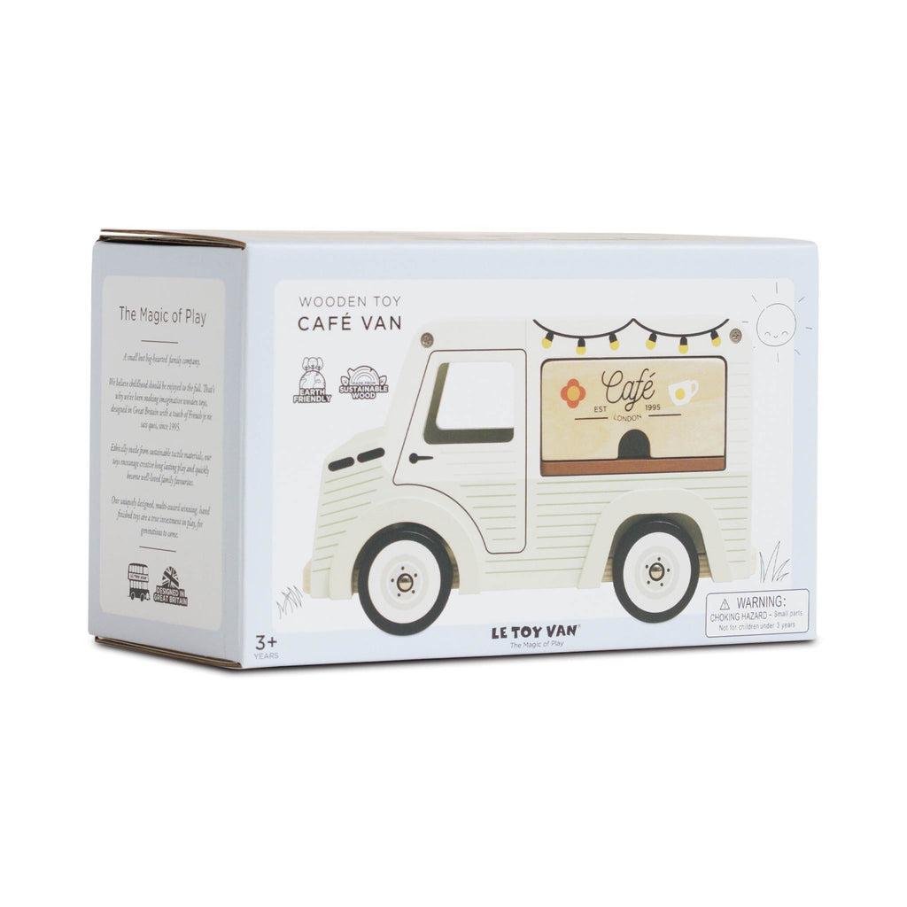 Packaging of a Le Toy Van wooden café van. The box shows a cute vintage-style toy van with festive lights.